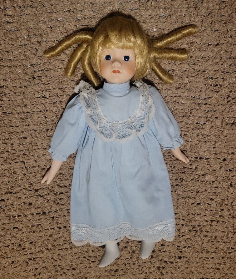 VINTAGE PORCELAIN DOLL WITH BLONDE HAIR CURLS