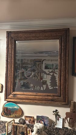Nice mirror with metal scenery.
