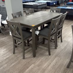 Caitbrook Counter Height Dining Table and 6 Bar Stools