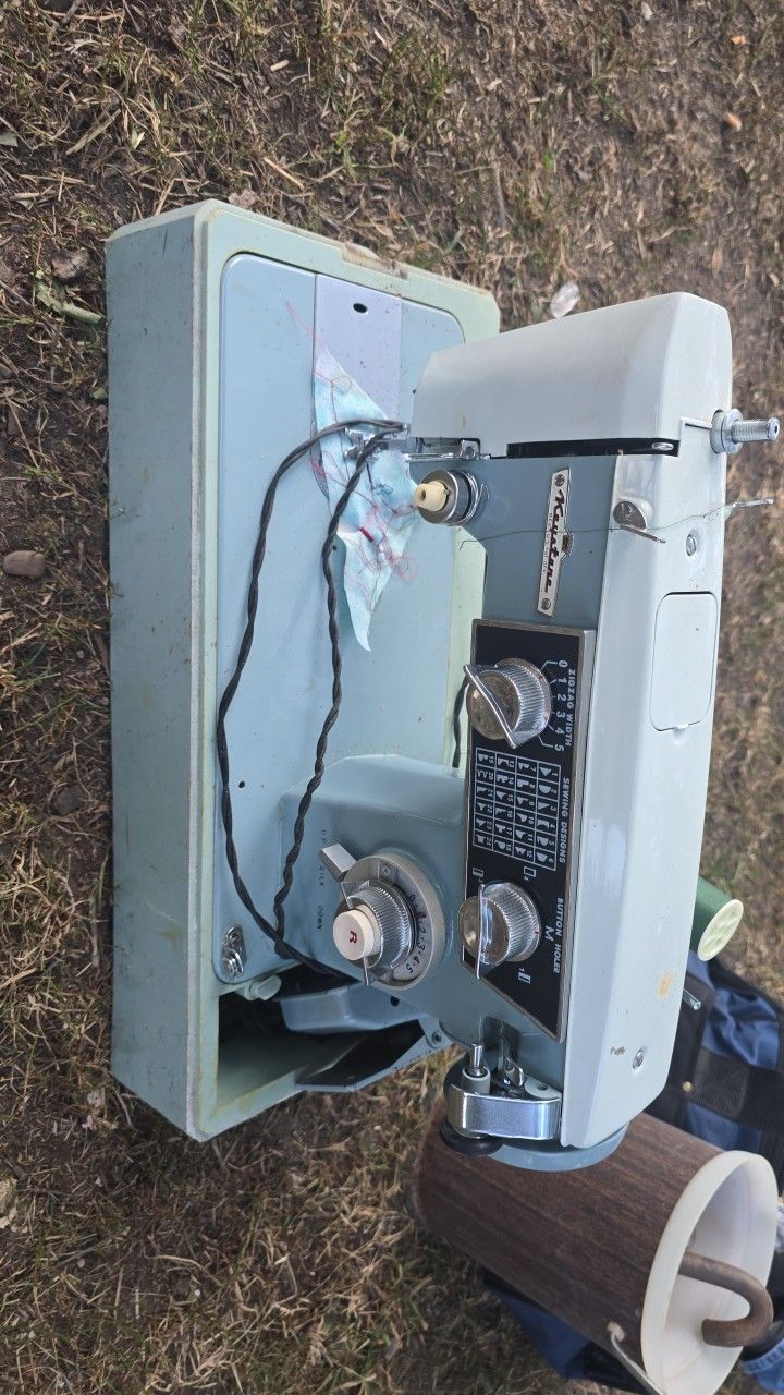 vintage or antique sewing machine, from the brand "Keyatane" as seen on the machine itself. 