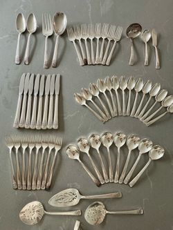 A 57 piece set of Adoration silverplate silverware by 1847 Rogers Bros of Waterbury, Connecticut