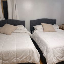 Gray full size beds with mattresses