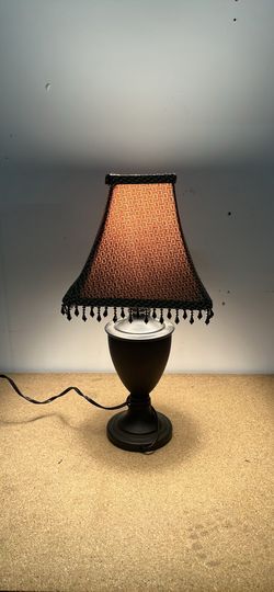 Cute table lamp with dark base and beaded shade