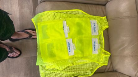 Cooling vest with eight reusable ice packs
