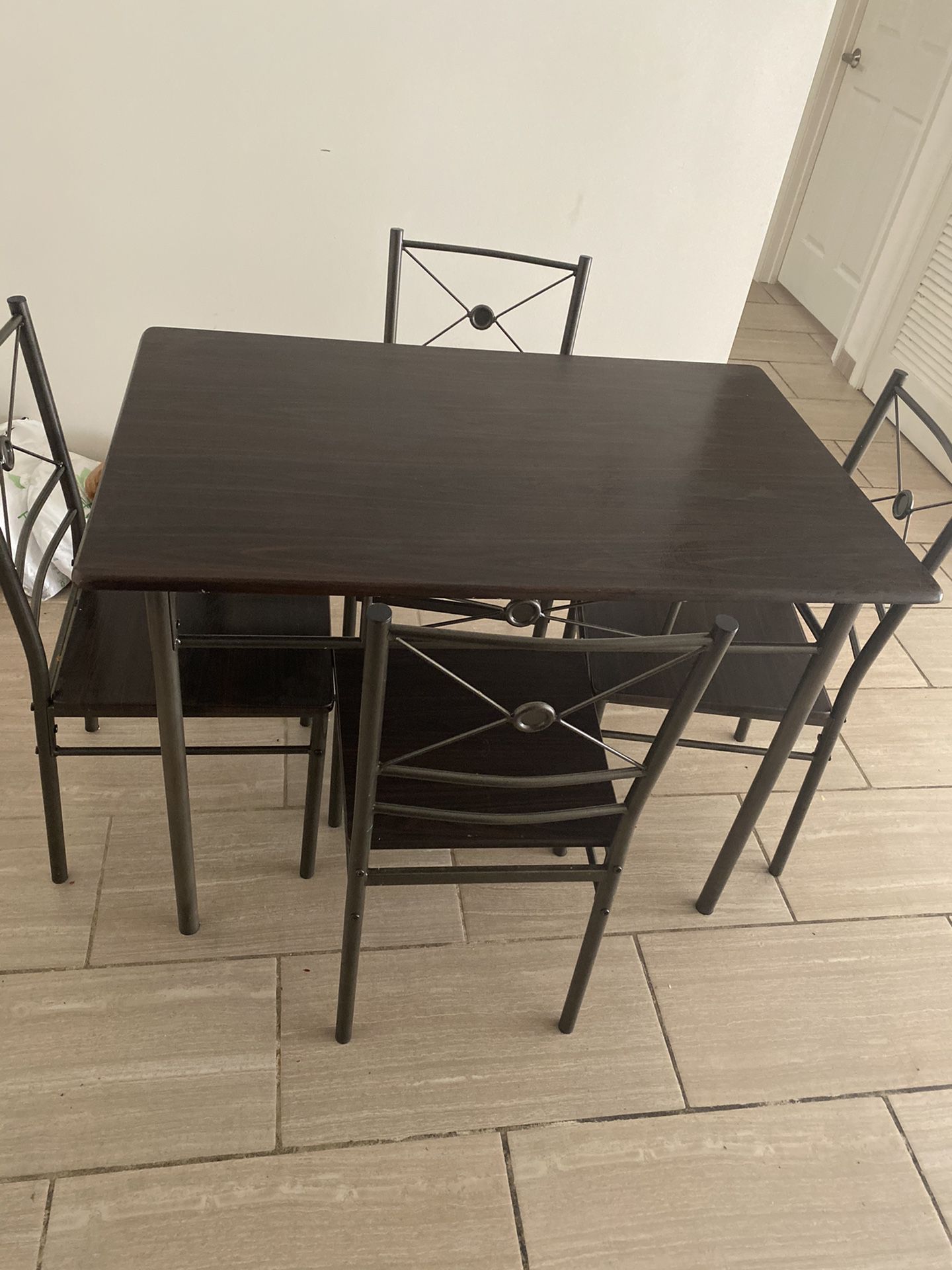 Dining table with 4 chairs....in good condition