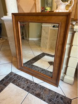 Ethan Allen wall mirror.  The frame is made from solid cherry wood and as well well-made