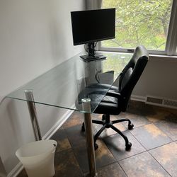 Glass desk with a chair