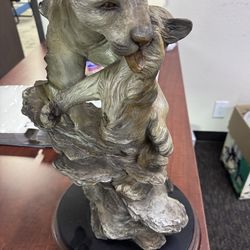 Mountain lion with cub sculpture