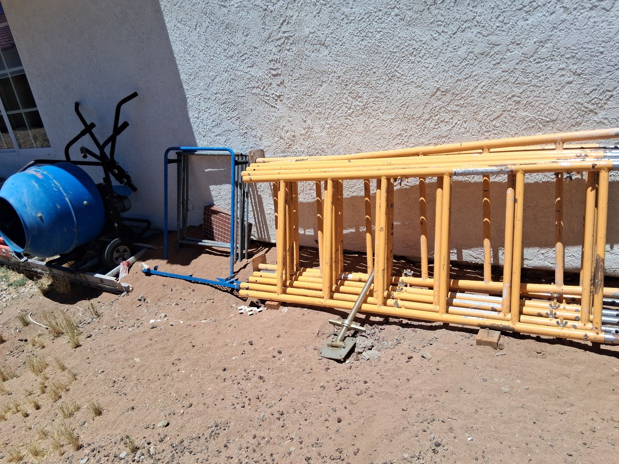 scaffolding and concrete mixer