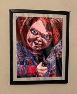 custom art piece of chucky from childs play on black frame