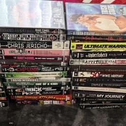 LOT OF 58 WWE DVDS