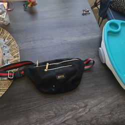 GUCCI FANNY PACK It Is A Red Green Color With Nice Gold Zipers The Size Doesn't Matter Around The Waist It Has Adjustable Straps