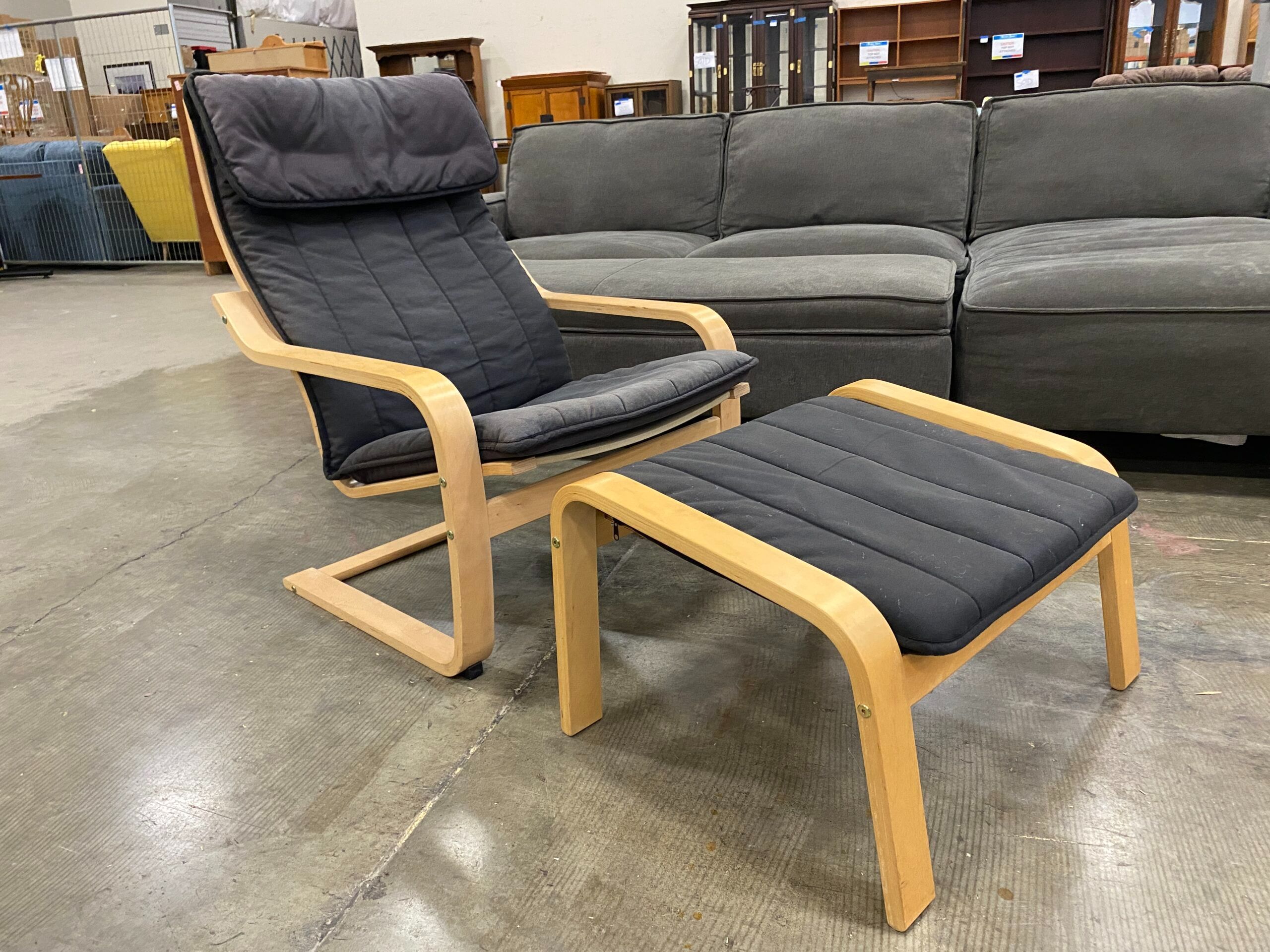 IKEA Light Wood Poang Rocker and Ottoman with Black Cushions