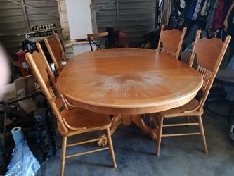 Wood pedestal dining table with 4 chairs