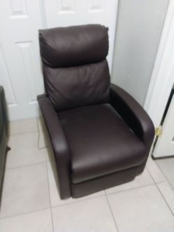 Reclining chair with built -in massager