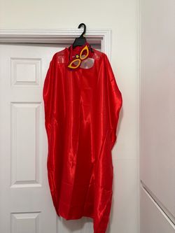 Red satin cape with mask could be for kids or adult length from neck to bottom is 44 inches long can be used for different costumes