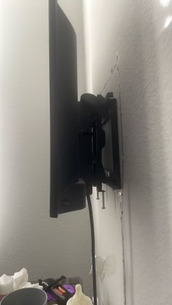 Onn TV with mounting hardware