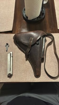 German holster with clip and tear down Tool