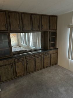 Wood Grain Cabinet Set with Dark Countertop