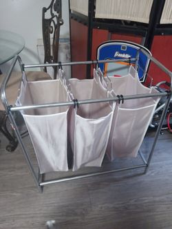Three unit laundry basket with detachable bags
