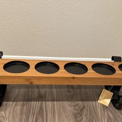 Wood candle holder with metal scroll