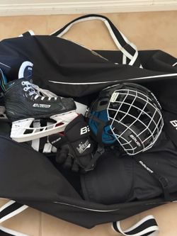 All$30。Full set of ice hockey gear. Size 12 skates; youth-sized helmet