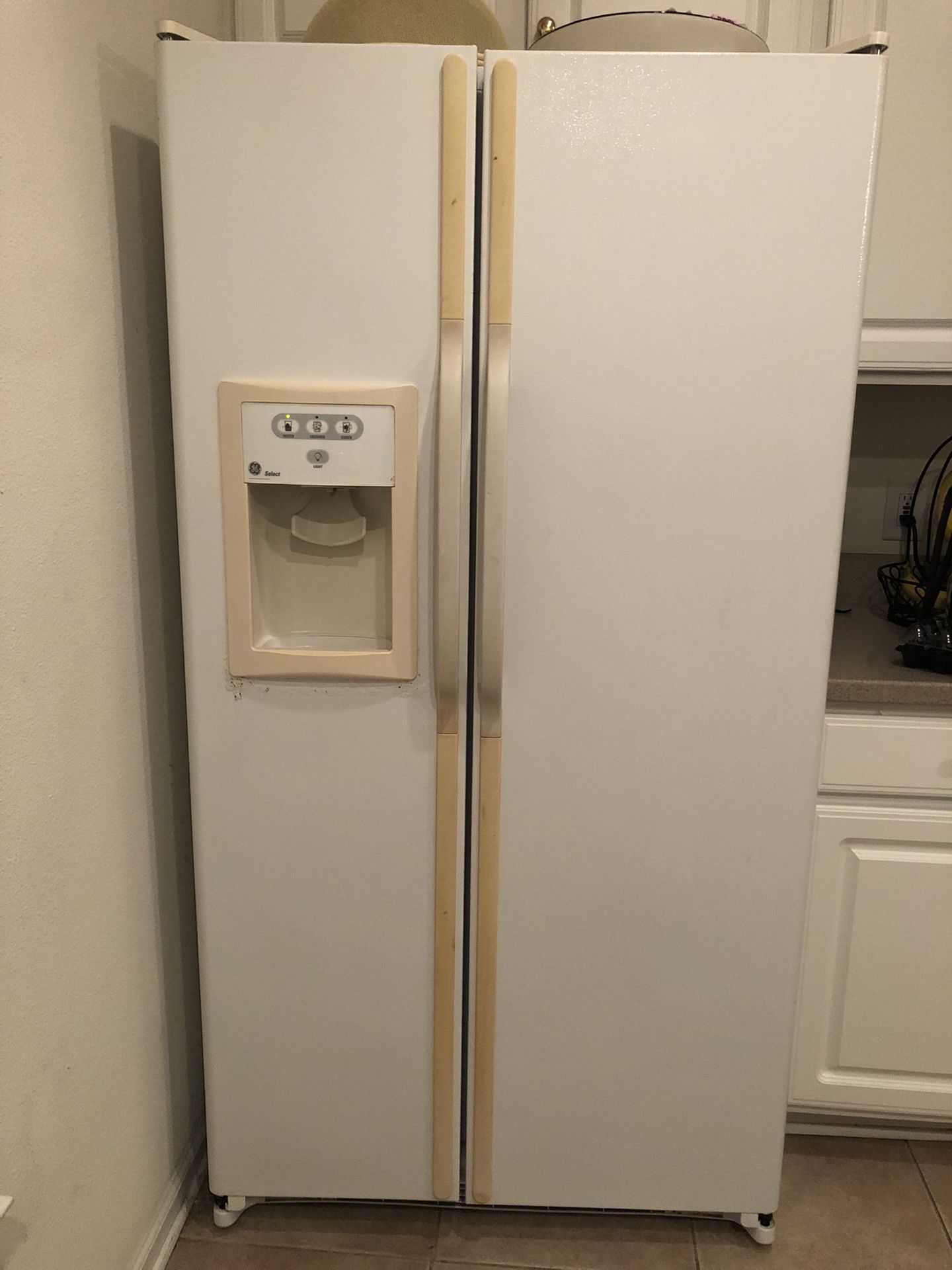 GE Double Door Refrigerator. Normal wear and tear. Works well . Asking $650 or Best Offer.