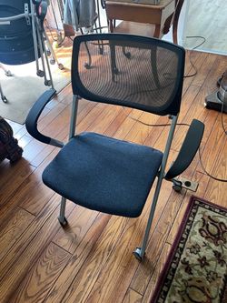 Stackable chairs with wheels.