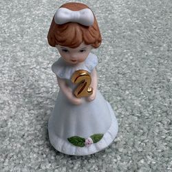 Vintage 1982 Enesco age 2 brunette, porcelain figurine from the growing up girls collection