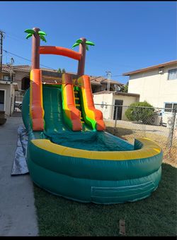 Inflatable water slide with pool