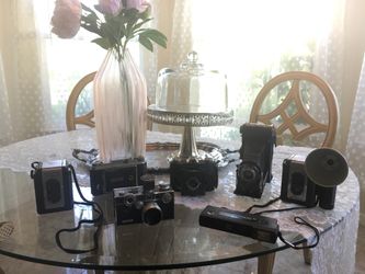 Collection of seven antique cameras