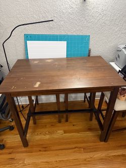 High top table and 4 chairs.