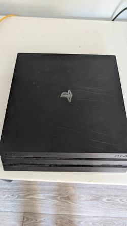 PlayStation 4 Pro w/games and controllers