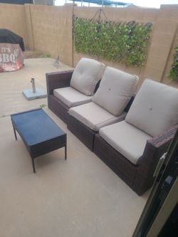 Patio set with new pillows and two chairs