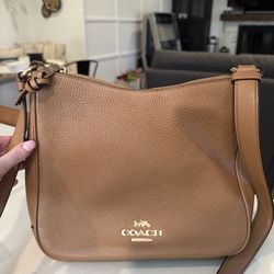 Coach pebbled leather zip-top crossbody / shoulder bag (brown saddle
