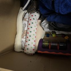 Box full of baby items And clothes