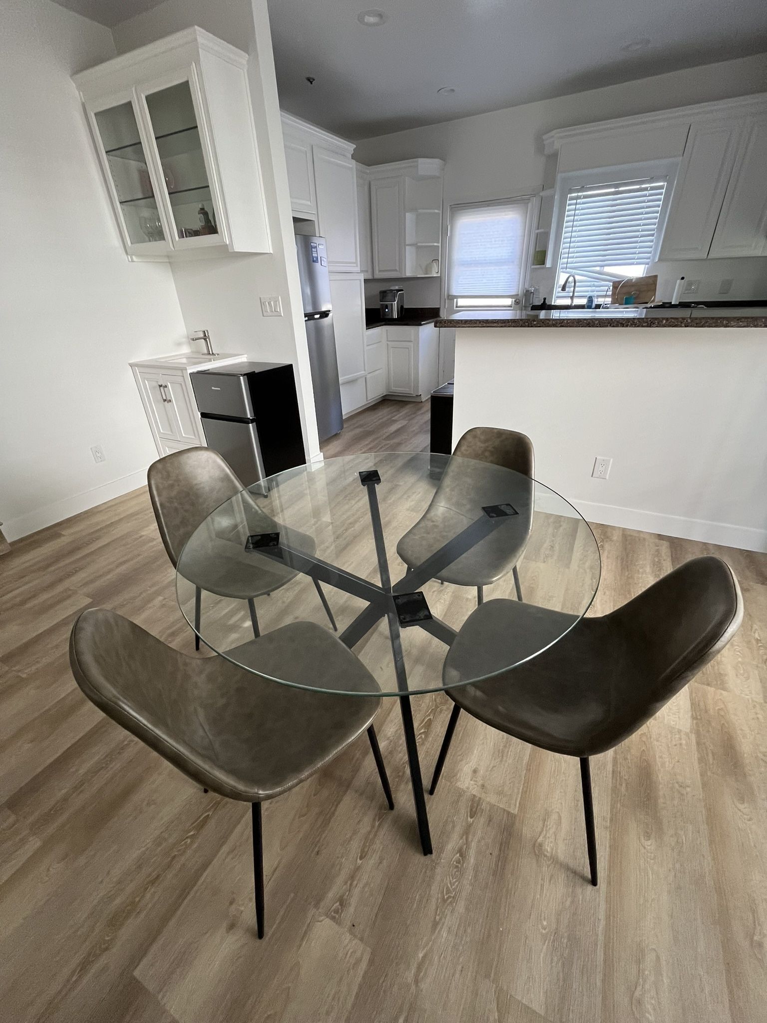 Dining Set: Glass Table + Four Grey Chairs