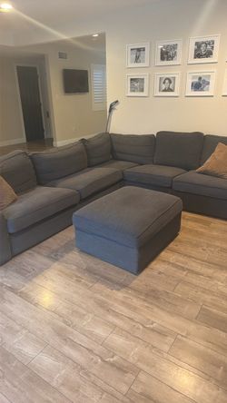 Grey couch and ottoman