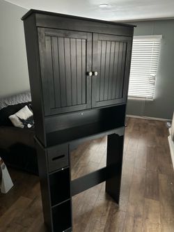 Black over the toilet storage