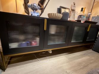 Article large black and brass credenza
