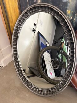 Oval mirror with fluted silver edge
