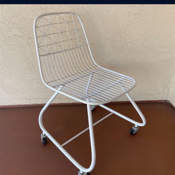 One Modernist White Wire Cantilever Metal Chair on Casters