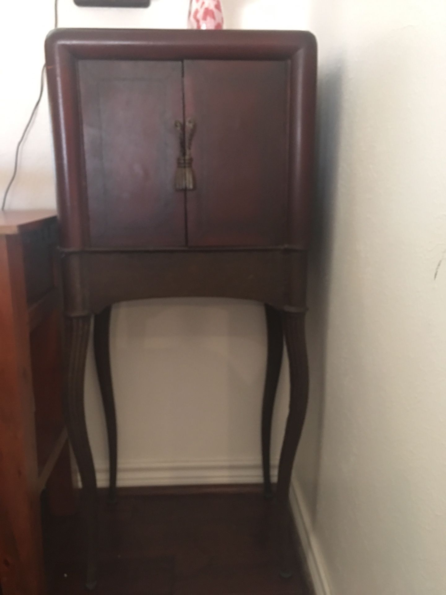 Antique cabinet with iron legs