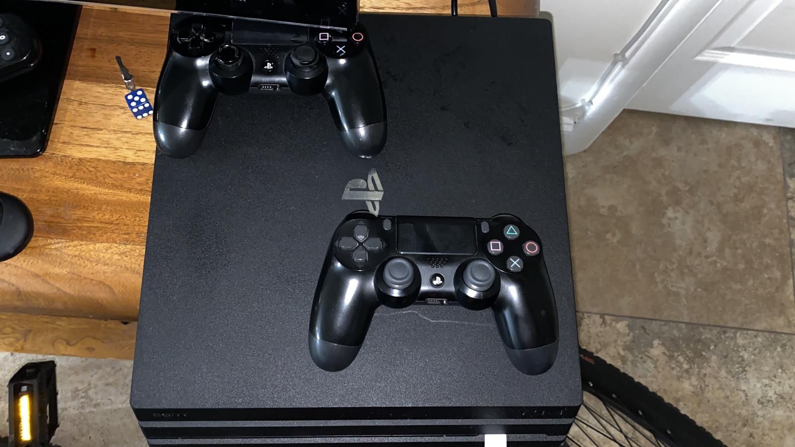 PS4 PRO 1TB with 3 controllers slightly used