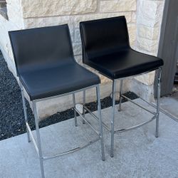 2 Bar Stools. 1 Gray And 1 Black 