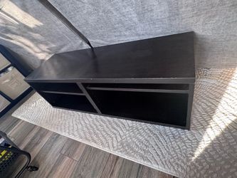 2 black storage shelves tv stands