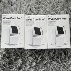 3 Wyze Cam Pan Security Cameras. 