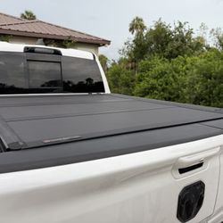 BAKFLIP MX4 HARD TRI-FOLD TONNEAU COVER  WITH SILVER CARGO RAILS RAM 1500