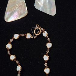  Triangular, iridescent mother-of-pearl or abalone shell 