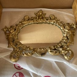 Antique Mirror In A Metal frame 